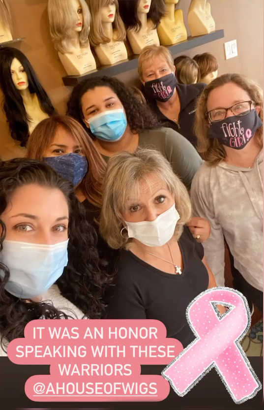 Rosemary with a group of women and a pink ribbon